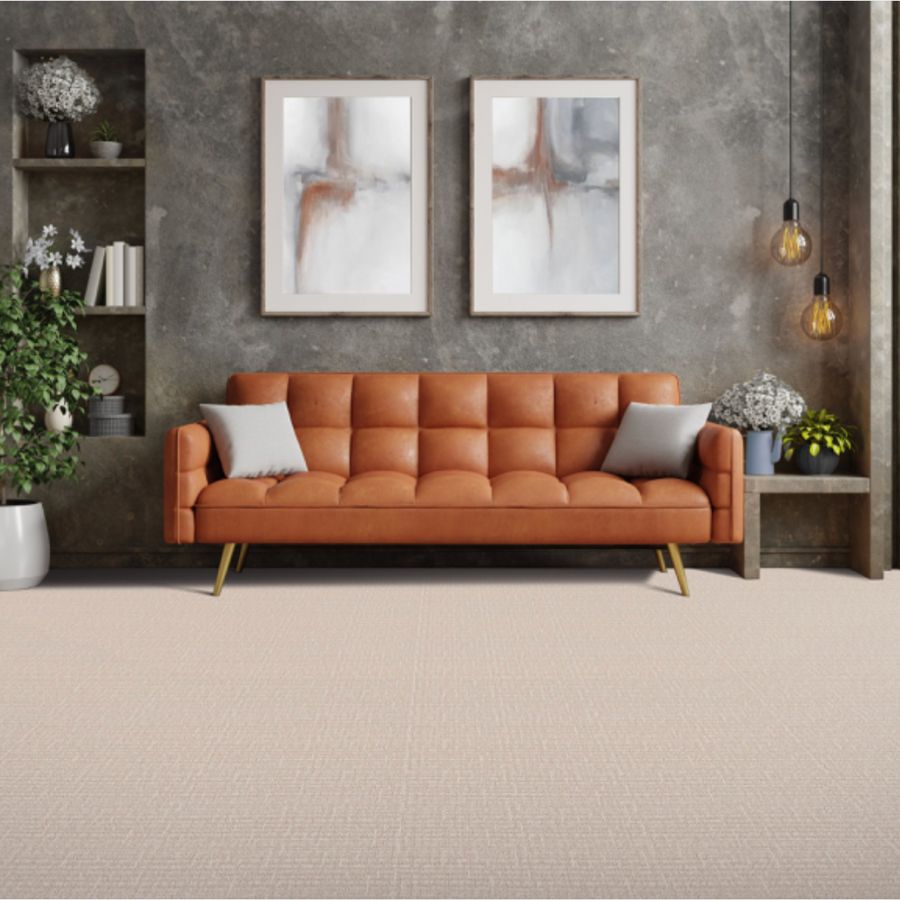 carpet, orange couch, wall art in living room